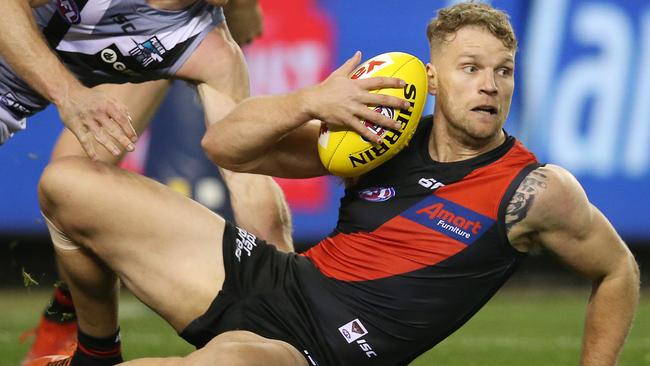 AFL Round 20. 03/08/2019.   Essendon v Port Adelaide at Marvel Stadium.  Essendon's Jake Stringer  battles with Tom Jonas of the Power late 1st quarter     .  Pic: Michael Klein