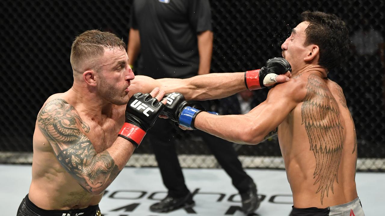 Alexander Volkanovski punches Max Holloway. (Photo by Jeff Bottari/Zuffa LLC via Getty Images)