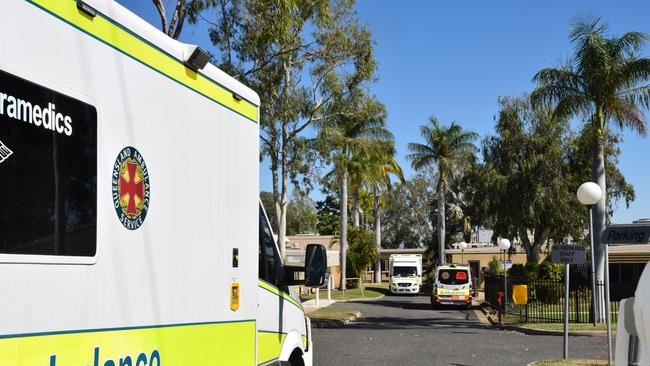 Ambulances queue outside of North Rockhampton Nursing Centre as the transfer of some patients started following the nurse’s positive test results.