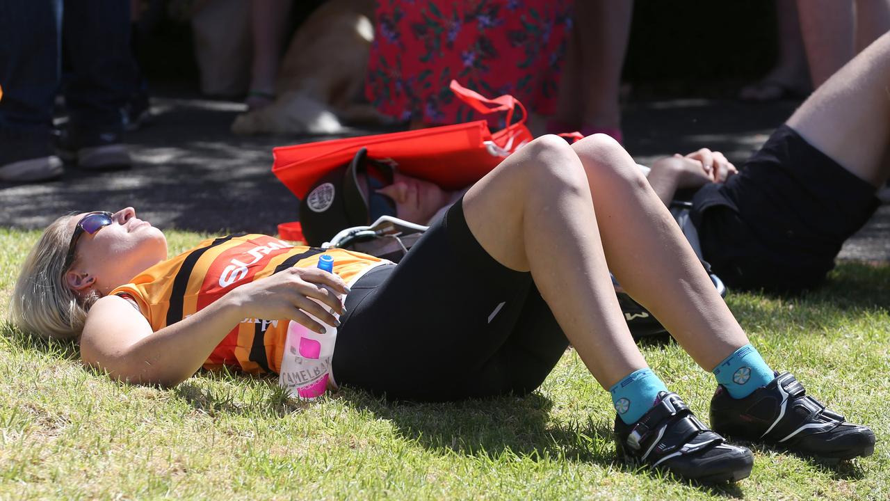 Rachel O’Higgins, 32 from Melbourne, recovering after riding the 60km from Victor Harbour. (AAP Image/Dean Martin)