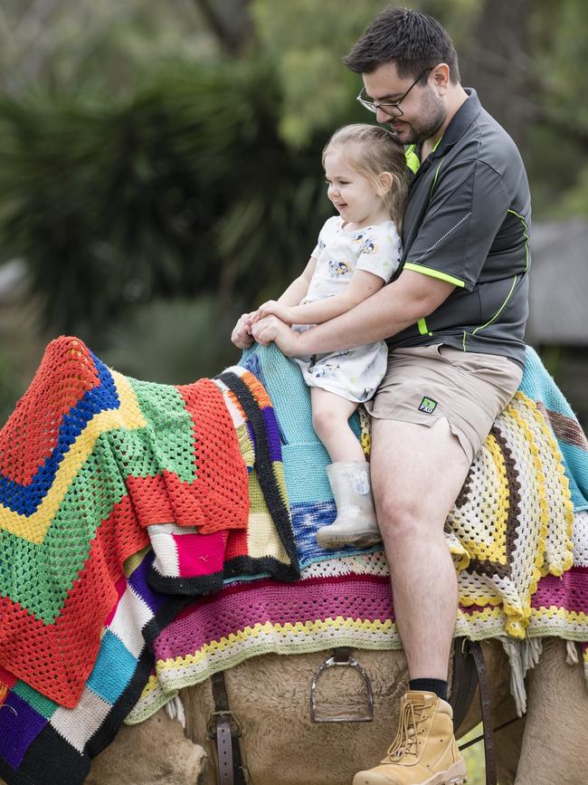 Ivy Rust and dad Michael Rust enjoy a camel ride at the Toowoomba Royal Show, Saturday, April 1, 2023. Picture: Kevin Farmer