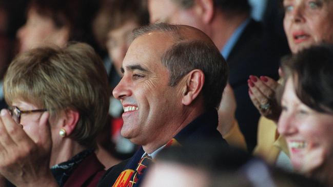 SA politician Premier John Olsen watching the Adelaide Crows at the MCG.