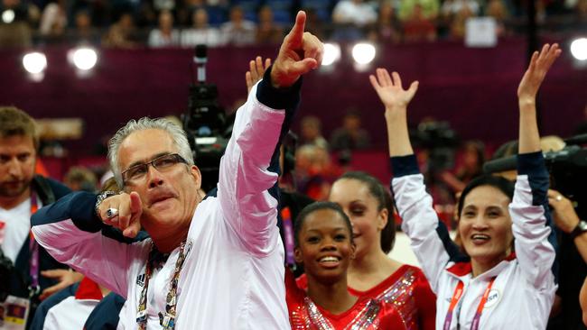 John Geddert celebrates with the rest of the team after the US won gold in the women's team artistic gymnastics at the 2012 London Olympics. Picture: AFP