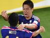 Japan's Yoshinori Muto (L) celebrates with Shinji Kagawa (R) after Kagawa scored a goal in the Asian Cup football match between Japan and Jordan in Melbourne on January 20, 2015. AFP PHOTO / THEO KARANIKOS --- IMAGE RESTRICTED TO EDITORIAL USE - STRICTLY NO COMMERICAL USE --