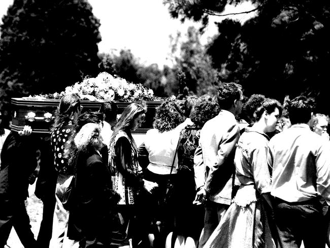 The killings left a legacy of grief and shock in the community. Mourners are pictured at the memorial service for victims.