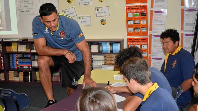 Justin Hodges and the Roma State College students discuss the importance of voting. Picture: James Liveris