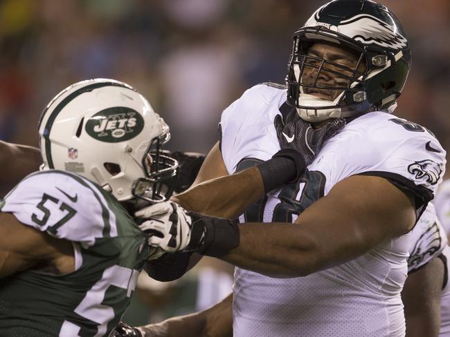 Obum Gwacham of the New York Jets rushes into Jordan Mailata.