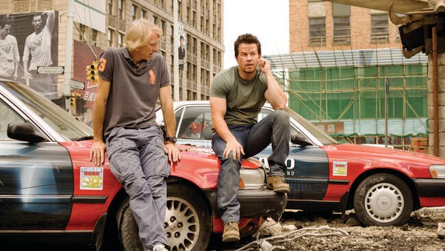 Hard-hitting combo ... director Michael Bay with Mark Wahlberg on the Transformers set in Detroit.