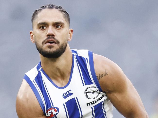 MELBOURNE, AUSTRALIA - AUGUST 07: Aaron Hall of the Kangaroos handballs during the round 21 AFL match between Richmond Tigers and North Melbourne Kangaroos at Melbourne Cricket Ground on August 07, 2021 in Melbourne, Australia. (Photo by Daniel Pockett/AFL Photos/via Getty Images)