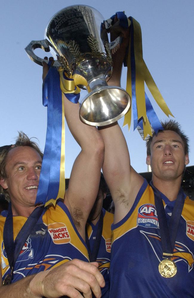 Adam Hunter and Daniel Chick with West Coast’s 2006 premiership trophy.