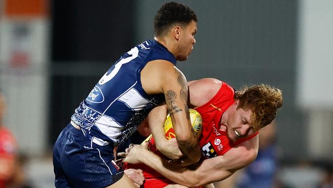Matt Rowell of the Suns is tackled. (Photo by Michael Willson/AFL Photos via Getty Images)