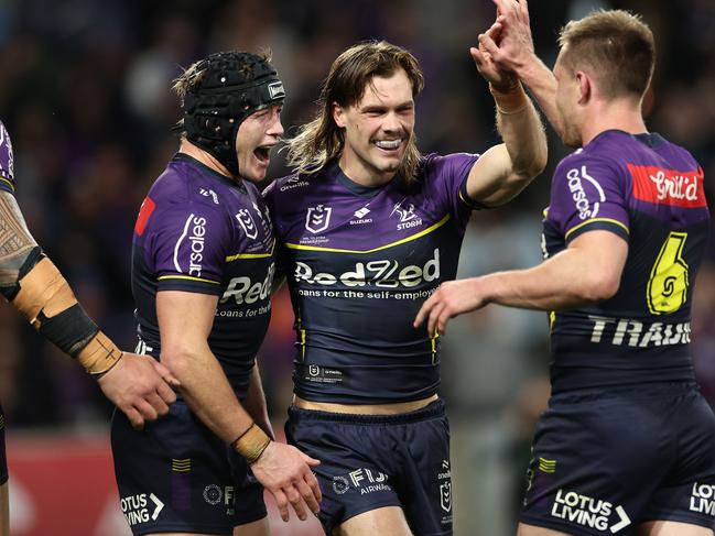 MELBOURNE, AUSTRALIA – SEPTEMBER 27: Ryan Papenhuyzen of the Storm celebrates with teammates after scoring a try during the NRL Preliminary Final match between the Melbourne Storm and Sydney Roosters at AAMI Park on September 27, 2024 in Melbourne, Australia. (Photo by Cameron Spencer/Getty Images)