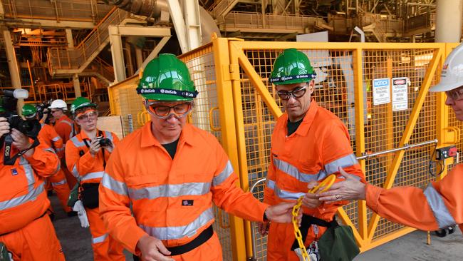 SA Premier Jay Weatherill (centre) and SA Energy Minister Tom Koutsantonis at BHP Billiton’s Olympic Dam smelter. Picture: AAP / David Mariuz