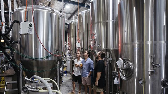 Friends enjoying a guided tour of the Six String Brewing Company brewery in Erina.