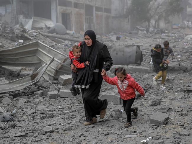 Palestinians flee the area after Israeli bombardment in central Gaza City. Picture: AFP