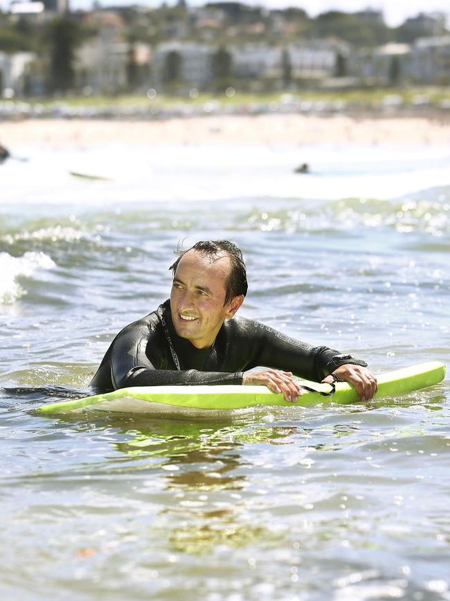 Mr Sharma grabs some waves. Picture: John Appleyard