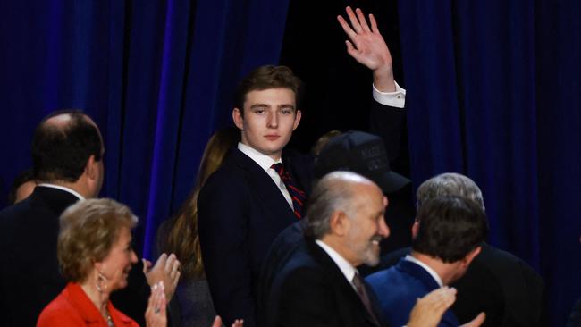 Barron Trump waves to supporters as he departs an election night event for Donald Trump at the Palm Beach Convention Centre.