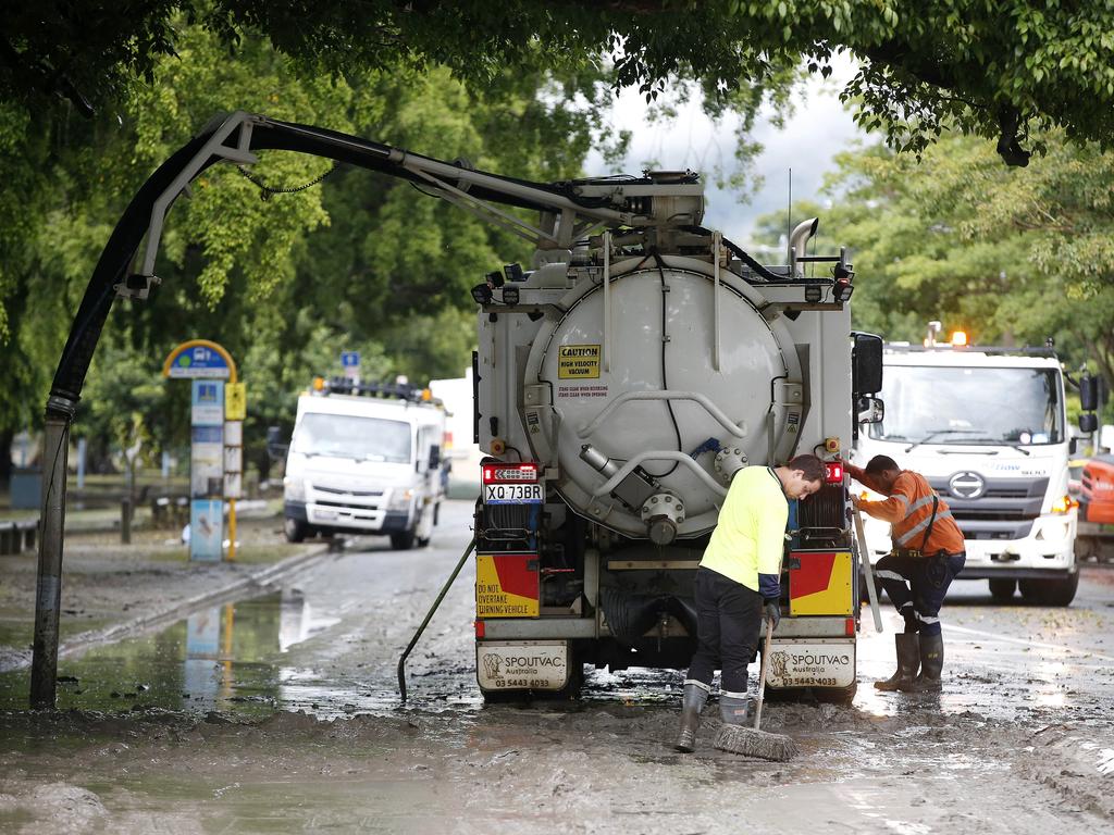 The clean-up in Brisbane. Photos: Josh Woning