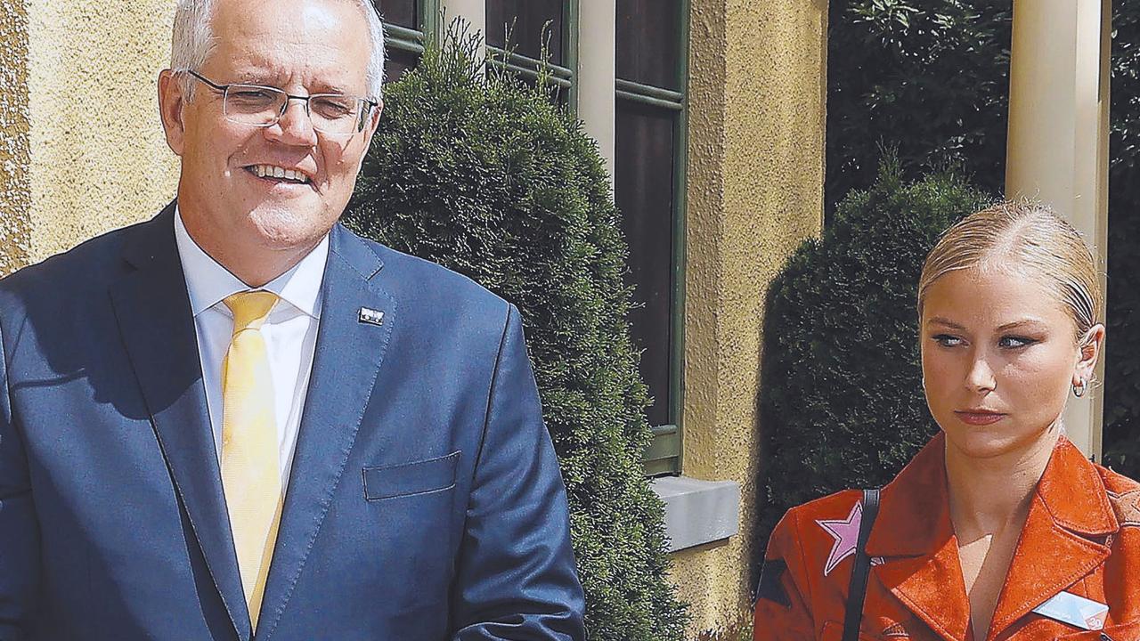 Former Prime Minister Scott Morrison with a disgruntled Grace Tame, who appeared to be uncomfortable with the meeting. Picture: NCA NewsWire / Gary Ramage