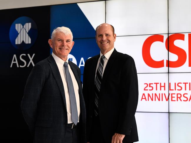 (L-R) CSL Limited Chairman Dr Brian McNamee and CSL Limited CEO and Managing Director Paul Perreault pose for a photograph during the CSL Limited 25th Listing Anniversary commemorative event at Australian Securities Exchange (ASX) in Sydney, Monday, October 14th, 2019. It has been 25 years since CSL Limited has been listed on the ASX. (AAP Image/Bianca De Marchi) NO ARCHIVING