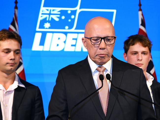 Former opposition leader Peter Dutton conceding defeat on election night, alongside his sons Harry and Tom, at the W Hotel on May 3, in Brisbane. Picture: Dan Peled/Getty Images.