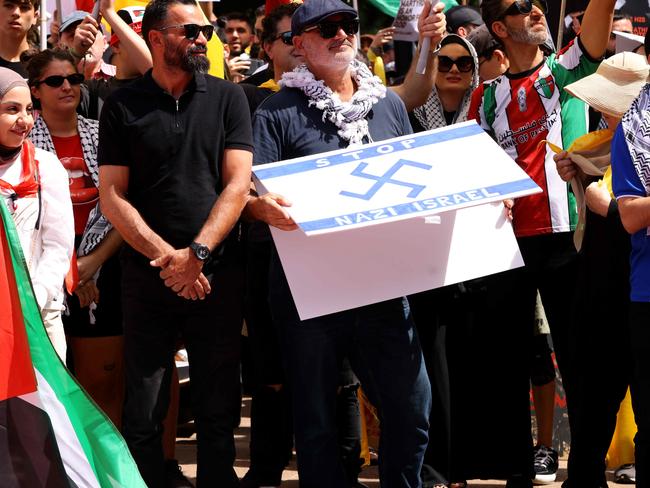 Alan Yazbek held up a sign with a swastika. Picture: NewsWire / Damian Shaw