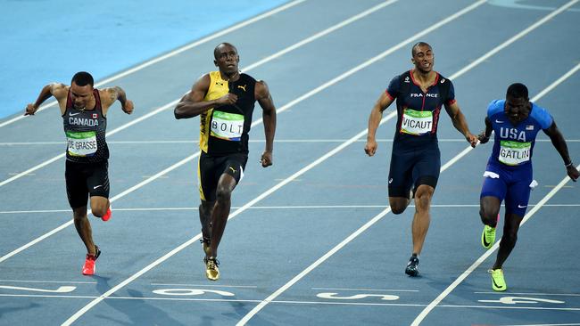 Usain Bolt of Jamaica win the men's 100m final ahead of Justin Gatlin.