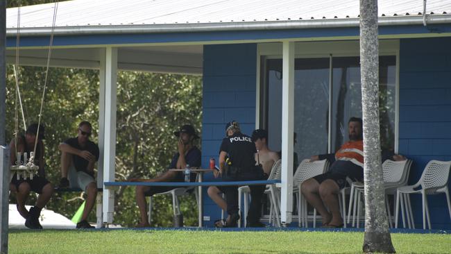 Police investigate the scene on the banks of the Burnett River and interview boaties following a serious boat crash.