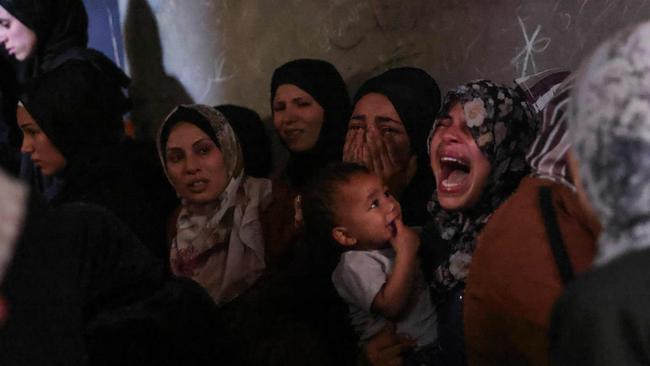 Palestinians mourn members of the Azzam family killed in Israeli strikes on their home in central Jabalia in the northern Gaza Strip. Picture: AFP