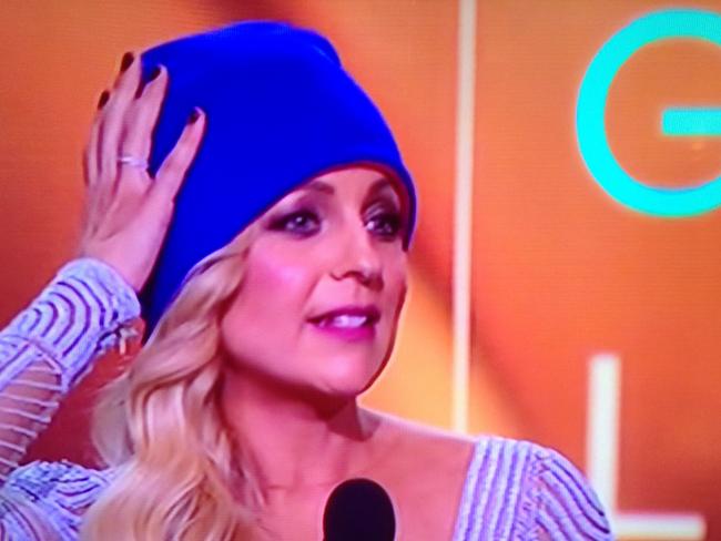 Carrie Bickmore wears a blue beanie as she is presented with her Gold Logie at the 57th Logie Awards.