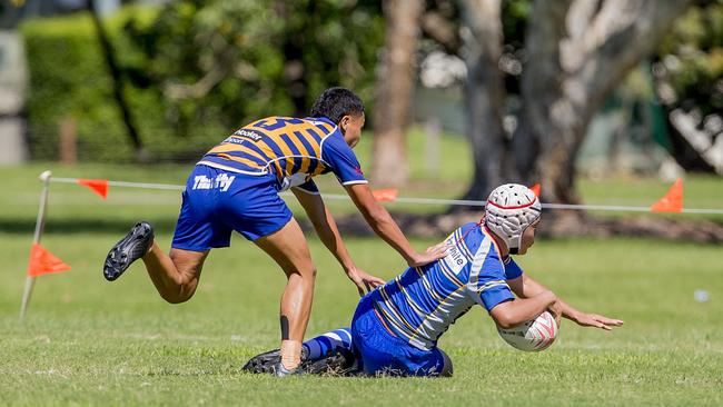 Day One of King of the Country rugby tournament at James Overell Park, Southport. possible. Sunshine Coast Invitational Barbarians U13s (Blue/yellow) v USQ Saints U13s (scoring with ball). Picture: Jerad Williams