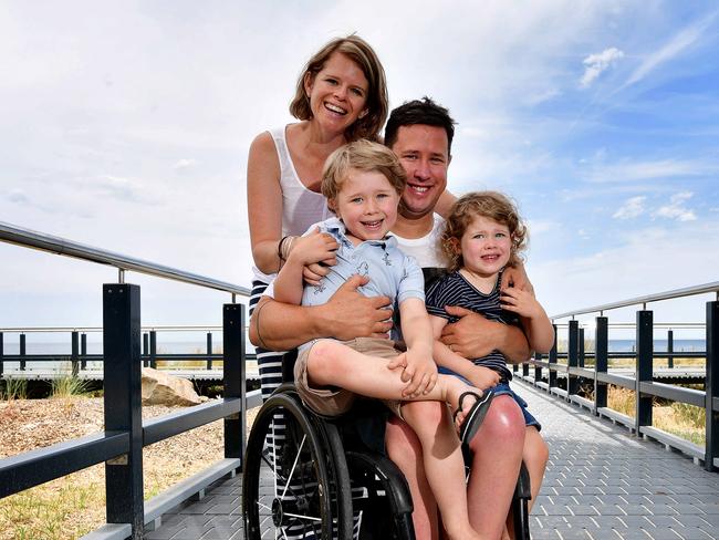 Scott and Clair Crowley with their children Oliver (5) & Maddy (3) at Seacliff beach. It is a story about traveling with a disability.Picture: Bianca De Marchi