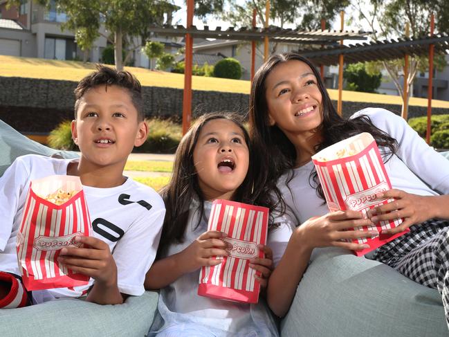 Get out the popcorn and set up a family movie night at home. Picture: Stuart Milligan