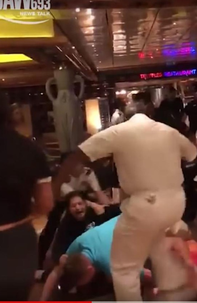 Cruise ship staff engage in a confrontation with members of a family on board the Carnival Legend cruise. Picture: 3AW.