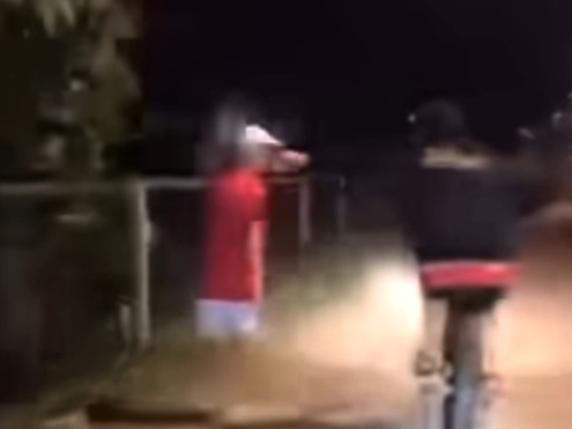 A video posted to a southern Gold Coast Facebook community page has shown the moment two boys conspire to throw a can of “piss” onto an innocent person who they ride past. Photo: Facebook