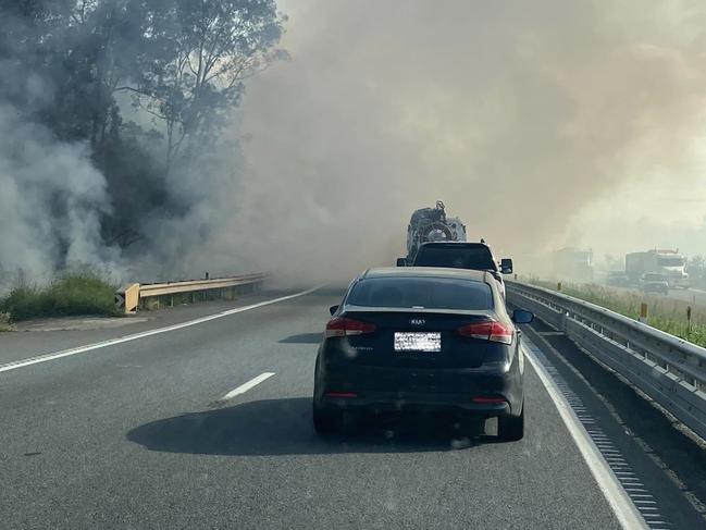 Smoke warning issued for areas around Blackwater near Ipswich as fire can be seen next to the Cunningham Highway. Photo: Ipswich Metal Recycling