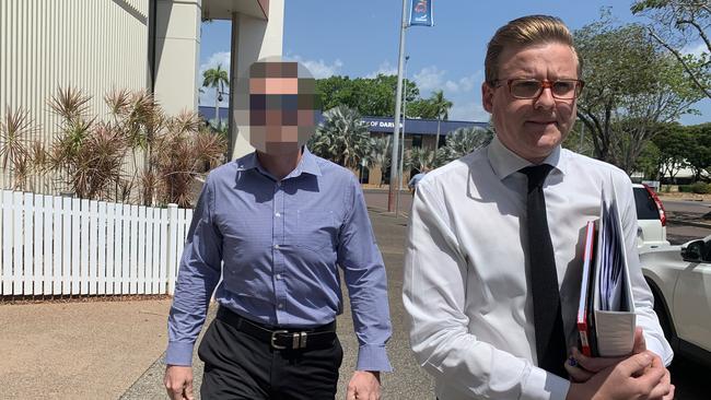 The NT police officer charged with rape, pictured with his lawyer Luke Officer. Picture: Sarah Matthews