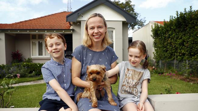 Michelle Barry, Conor and Emma walking their neighbour's dog Max. Picture: Sam Ruttyn