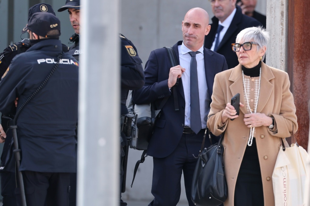 Luis Rubiales (2R) and his lawyer Olga Tubau (R) leave the court of San Fernando de Henares, east of Madrid