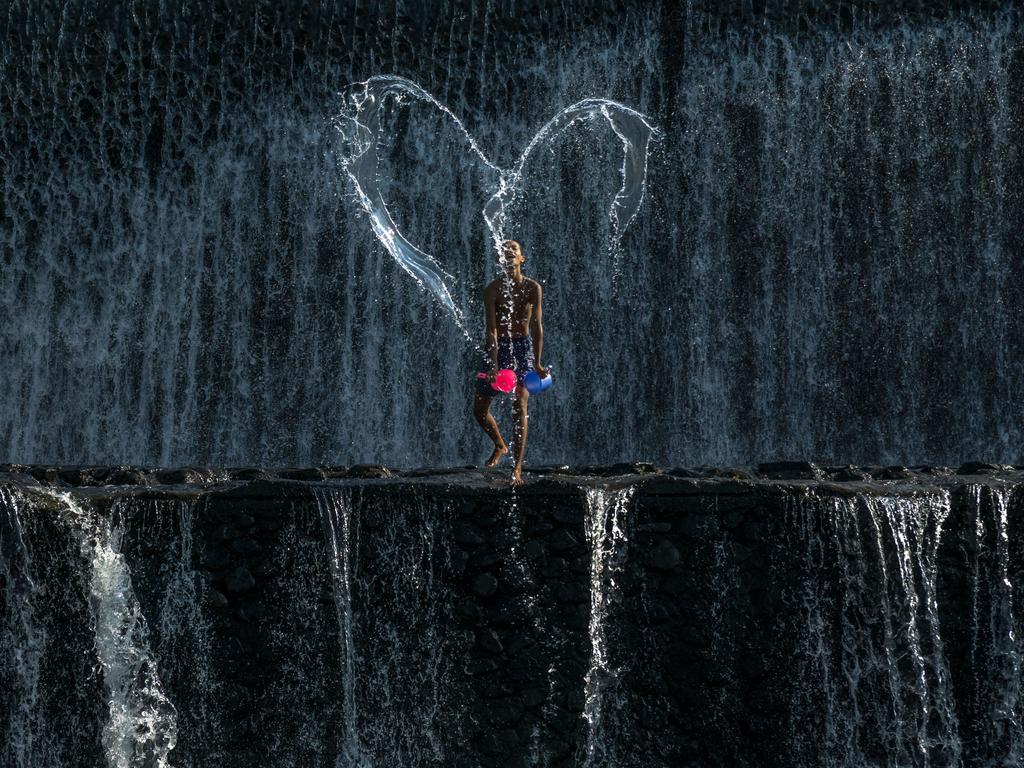 “A boy creatively made a LOVE shape at the River of Tukad Yeh Unda in Bali, Indonesia.” Picture: Cheung Yin Fang, Malaysia, Shortlist, Open Competition, Split Second, 2016 Sony World Photography Awards