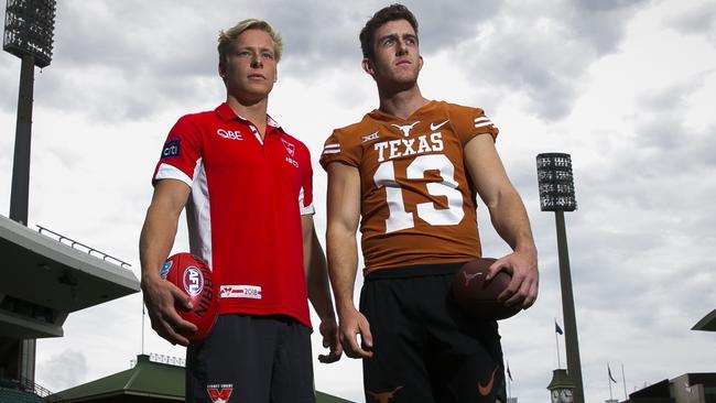 Isaac Heeney with Michael Dixon. Picture: Dylan Robinson