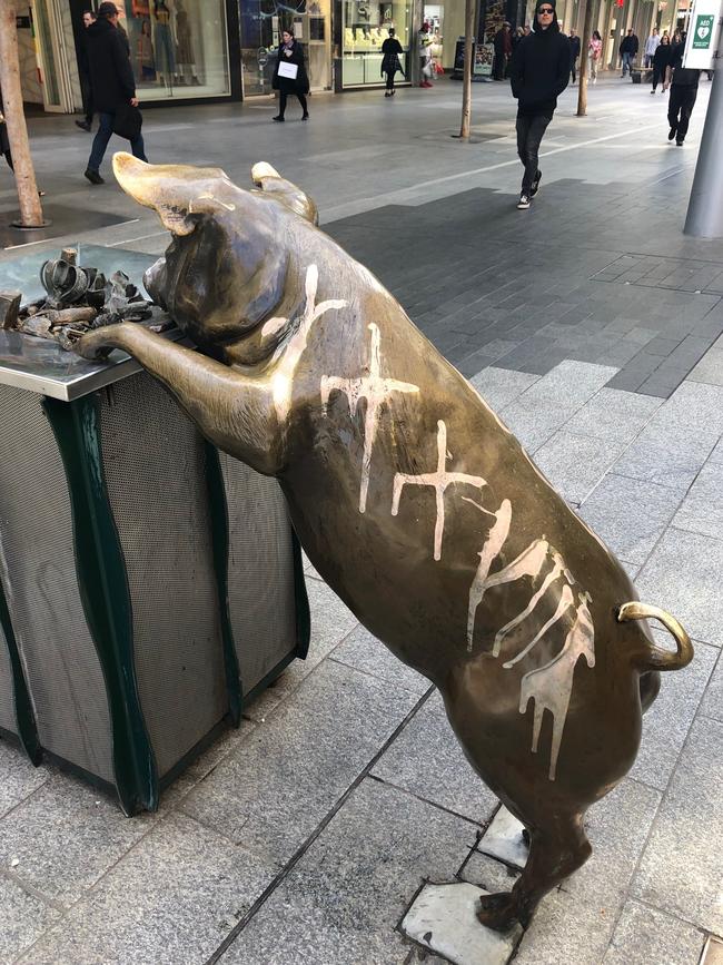 Offensive slogans and other markings were painted on the pigs in Rundle Mall. Picture: Supplied