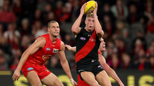 MELBOURNE, AUSTRALIA – AUGUST 10: Nate Caddy of the Bombers in action during the round 22 AFL match between Essendon Bombers and Gold Coast Suns at Marvel Stadium, on August 10, 2024, in Melbourne, Australia. (Photo by Jonathan DiMaggio/Getty Images)