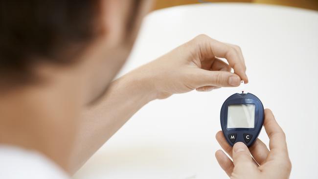 A diabetes sufferer checks his blood sugar level. Picture: Shutterstock