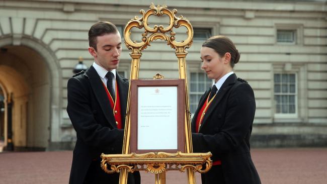 On Tuesday morning, Buckingham Palace footmen set up an official notice announcing the birth of a son to Prince Harry and Meghan Markle. Picture: Yui Mok/AFP