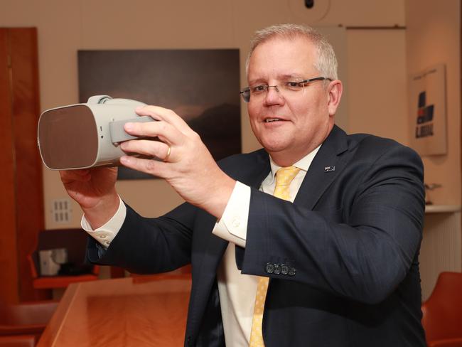 A powerful storytelling device … PM Scott Morrison tests Anzac360 on an Oculus headset in November 2019. Picture Gary Ramage