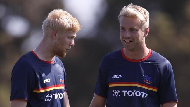 MELBOURNE, AUSTRALIA - FEBRUARY 22: Billy Frampton of the Crows (R) and Elliott Himmelberg of the Crows are seen before the 2020 Marsh Community Series match between the Melbourne Demons and the Adelaide Crows at Casey Fields on February 22, 2020 in Melbourne, Australia. (Photo by Dylan Burns/AFL Photos via Getty Images)