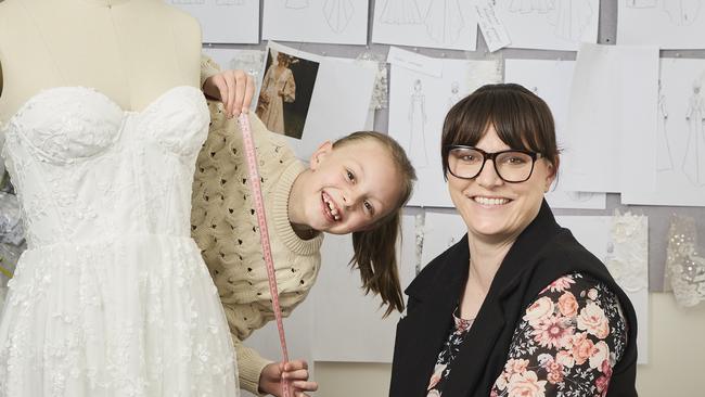 Eloise Hopton, 7, with mum Shannon Hopton at Adelaide Hills Bridal in Mount Barker, where Eloise is learning to sew. Picture: Matt Loxton