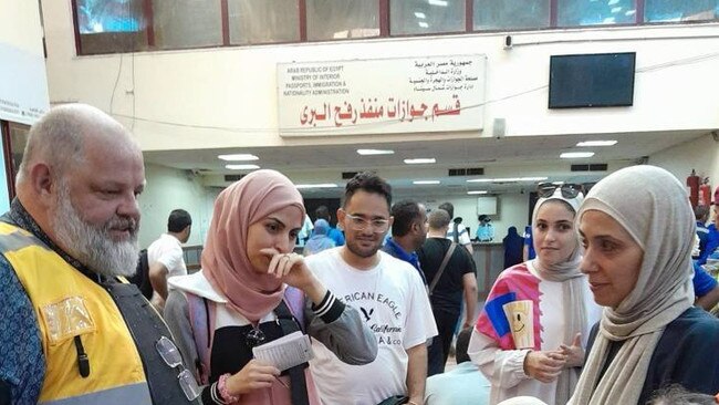 An Australian consular official assists Australians who were able to leave Gaza and enter Egypt at Rafah at the beginning of November. Picture: DFAT via NCA NewsWire