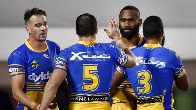 Eels celebrate a try against the Warriors.